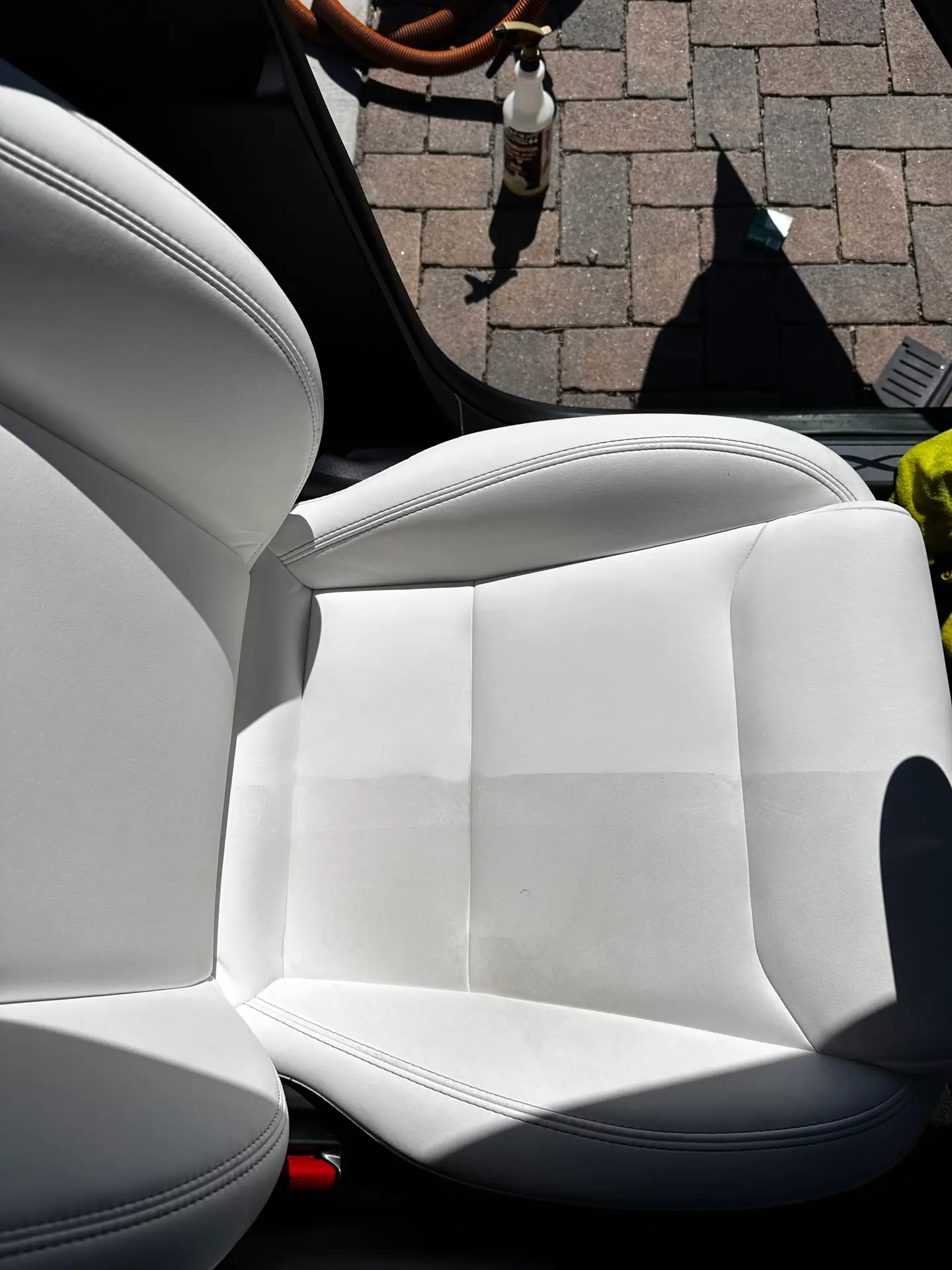 Tesla model X white seats being professionally cleaned at CDA auto styling in Riverside CA