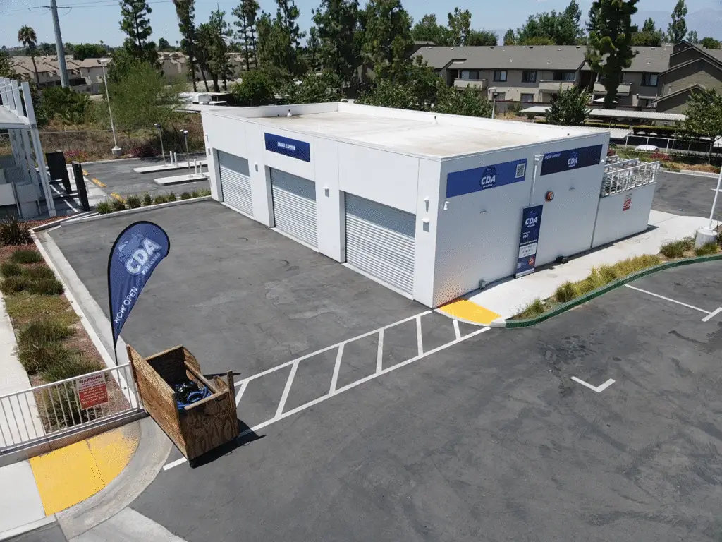 mobile detailing Aerial drone photo of CDA auto styling shop exterior in Riverside CA showing the building parking lot and surrounding area
