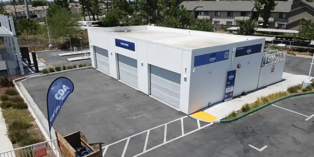 Riverside Paint Protection Aerial drone photo of CDA auto styling shop exterior in Riverside CA showing the building parking lot and surrounding area